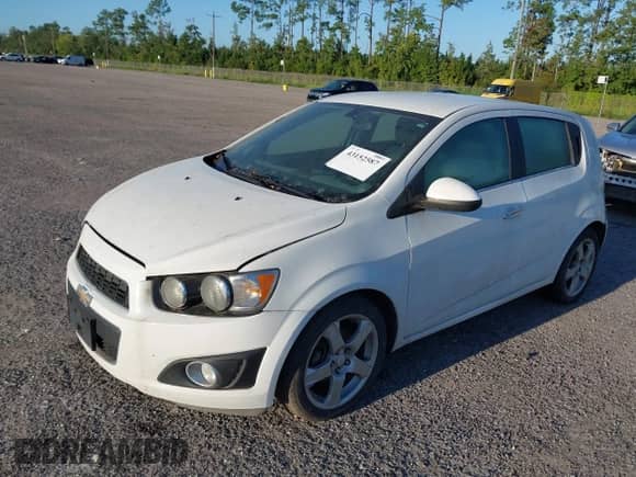 2014 Chevrolet Sonic LTZ with VIN 1G1JE6SB7E4186829, listed as a IAAI auction lot 43152587 with 100,844 mi miles and . Bid and sale history available at DreamBid. Image 2.
