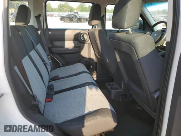 2009 Dodge Nitro SE с VIN 1D8GU28K79W511897, выставлен на аукционе Copart как лот 81119315 с пробегом 105 378 миль миль и Списание • Salvage title. История ставок и продаж доступна на DreamBid. Изображение 11.