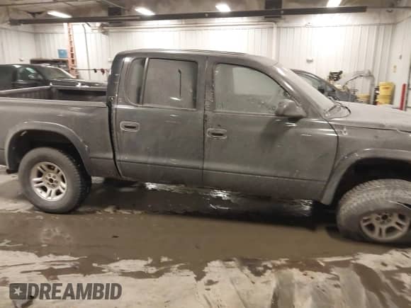 2003 Dodge Dakota Sport with VIN 1D7HG38X53S235378, listed as a IAAI auction lot 41400147 with 112,707 mi miles and . Bid and sale history available at DreamBid. Image 13.