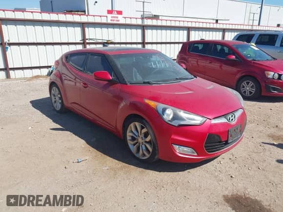 2012 Hyundai Veloster w/Gray Int z VIN KMHTC6AD1CU051606, wystawiony jako IAAI lot #43436964 z przebiegiem 144 149 mil mil oraz . Historia ofert i sprzedaży dostępna na DreamBid. Obrazek 1.