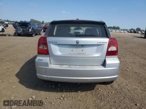 2010 Dodge Caliber Mainstreet with VIN 1B3CB3HA3AD648594, listed as a Copart auction lot 71647135 with 94,206 mi miles and Salvage title. Bid and sale history available at DreamBid. Image 6.