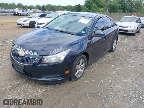 2014 Chevrolet Cruze 1LT z VIN 1G1PC5SB3E7456082, wystawiony jako IAAI lot #42343486 z przebiegiem 136 682 mil mil oraz . Historia ofert i sprzedaży dostępna na DreamBid. Obrazek 2.