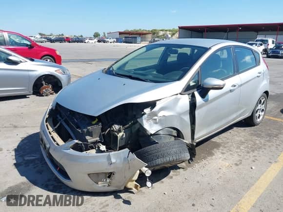2011 Ford Fiesta SES with VIN 3FADP4FJ9BM146004, listed as a IAAI auction lot 43277473 with 147,864 mi miles and . Bid and sale history available at DreamBid. Image 2.
