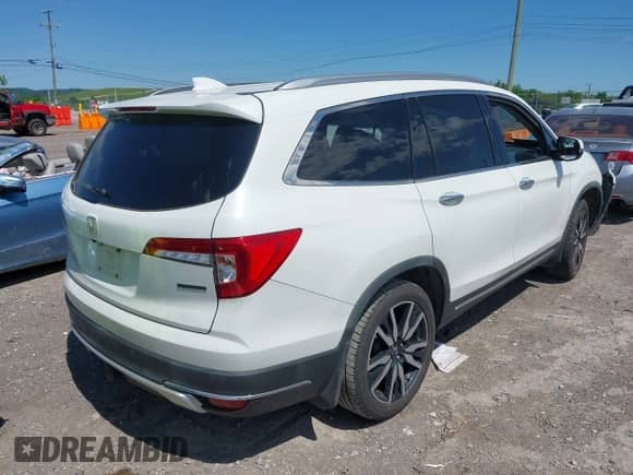 2020 Honda Pilot Touring 7-Passenger z VIN 5FNYF5H69LB000835, wystawiony jako IAAI lot #42318516 z przebiegiem 122 572 mil mil oraz . Historia ofert i sprzedaży dostępna na DreamBid. Obrazek 4.