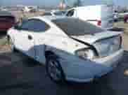 2004 Hyundai Tiburon GS z VIN KMHHM65D64U107599, wystawiony jako IAAI lot #42895093 z przebiegiem 184 234 mil mil oraz . Historia ofert i sprzedaży dostępna na DreamBid. Obrazek 3.