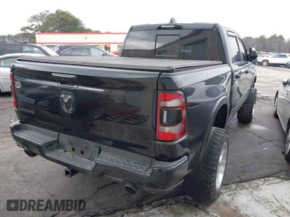 2021 Ram 1500 Laramie with VIN 1C6RREJTXMN629722, listed as a IAAI auction lot 41285829 with 59,638 mi miles and . Bid and sale history available at DreamBid. Image 4.