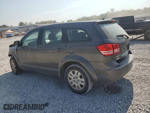 2014 Dodge Journey American Value with VIN 3C4PDCAB7ET165624, listed as a Copart auction lot 80356455 with 199,529 mi miles and Salvage title. Bid and sale history available at DreamBid. Image 2.