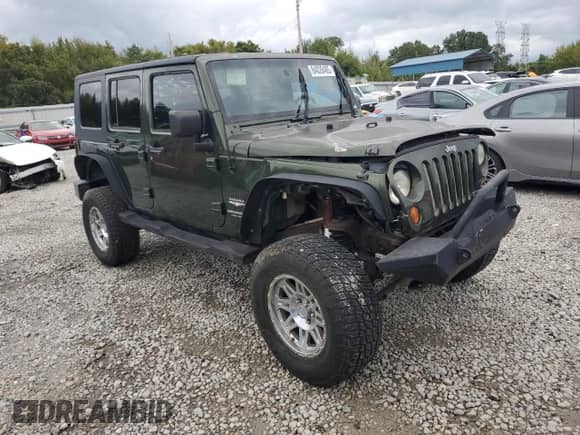 2007 Jeep Wrangler Unlimited Sahara z VIN 1J4GA59157L198095, wystawiony jako Copart lot #84028485 z przebiegiem 198 022 mil mil oraz Czysty tytuł • Clean title. Historia ofert i sprzedaży dostępna na DreamBid. Obrazek 4.