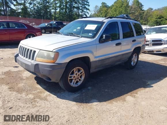 2004 Jeep Grand Cherokee Laredo with VIN 1J4GX48S54C401873, listed as a IAAI auction lot 43337181 with 274,149 mi miles and . Bid and sale history available at DreamBid. Image 2.