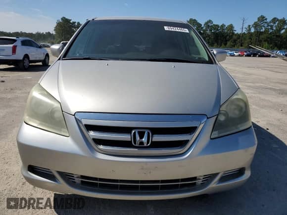 2005 Honda Odyssey EX z VIN 5FNRL38405B418106, wystawiony jako Copart lot #69424465 z przebiegiem 186 798 mil mil oraz Szkoda całkowita • Salvage title. Historia ofert i sprzedaży dostępna na DreamBid. Obrazek 5.