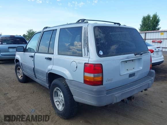 1996 Jeep Grand Cherokee Laredo z VIN 1J4GZ58S9TC245352, wystawiony jako IAAI lot #42860561 z przebiegiem Nie podano mil oraz . Historia ofert i sprzedaży dostępna na DreamBid. Obrazek 3.