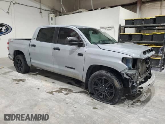 2020 Toyota Tundra SR5 with VIN 5TFEY5F14LX261476, listed as a Copart auction lot 70022205 with 180,181 mi miles and Salvage title. Bid and sale history available at DreamBid. Image 4.