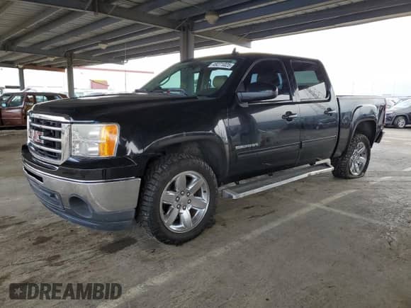 2012 GMC Sierra 1500 with VIN 3GTP1WE22CG290959, listed as a Copart auction lot 49271025 with 153,733 mi miles and Salvage title. Bid and sale history available at DreamBid. Image 1.