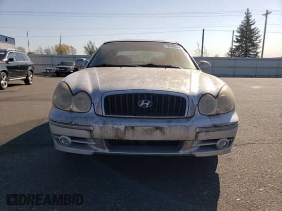 2003 Hyundai Sonata GLS z VIN KMHWF35H23A871372, wystawiony jako Copart lot #76199644 z przebiegiem 164 094 mil mil oraz Czysty tytuł • Clean title. Historia ofert i sprzedaży dostępna na DreamBid. Obrazek 5.