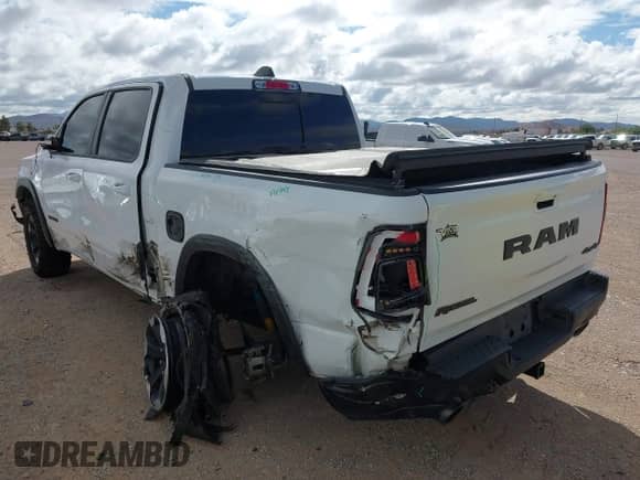 2022 Ram 1500 Rebel z VIN 1C6SRFLT4NN282636, wystawiony jako IAAI lot #42656360 z przebiegiem 38 884 mil mil oraz . Historia ofert i sprzedaży dostępna na DreamBid. Obrazek 14.