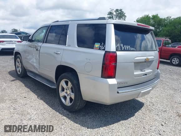 2015 Chevrolet Tahoe LTZ with VIN 1GNSCCKC9FR293871, listed as a IAAI auction lot 42630138 with 205,056 mi miles and . Bid and sale history available at DreamBid. Image 3.