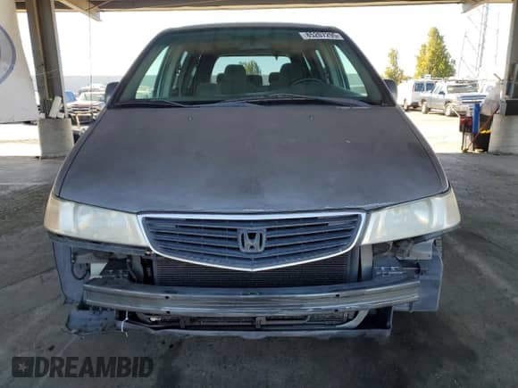 2001 Honda Odyssey EX with VIN 2HKRL18621H606756, listed as a Copart auction lot 85207295 with 301,823 mi miles and Salvage title. Bid and sale history available at DreamBid. Image 5.