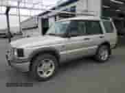 2000 Land Rover Discovery Cloth with VIN SALTY1541YA261319, listed as a Copart auction lot 86040445 with 153,917 mi miles and Clean title. Bid and sale history available at DreamBid. Image 1.