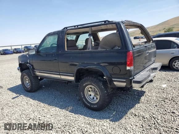 1998 Chevrolet Tahoe with VIN 3GNEK18R0WG112642, listed as a Copart auction lot 64304765 with 194,247 mi miles and Salvage title. Bid and sale history available at DreamBid. Image 2.
