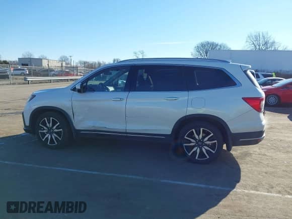 2021 Honda Pilot Touring 7-Passenger with VIN 5FNYF5H64MB031671, listed as a IAAI auction lot 41332415 with 90,411 mi miles and . Bid and sale history available at DreamBid. Image 14.