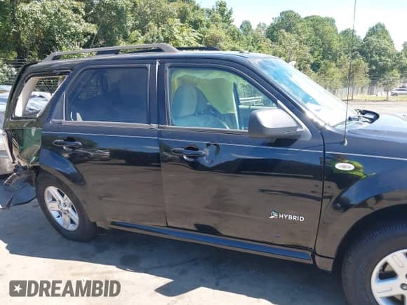 2009 Mercury Mariner Hybrid with VIN 4M2CU29359KJ17577, listed as a IAAI auction lot 43091811 with 247,830 mi miles and . Bid and sale history available at DreamBid. Image 14.