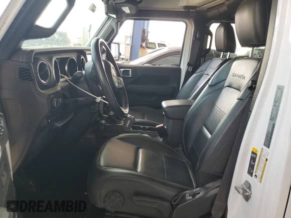 2022 Jeep Wrangler Unlimited Sahara with VIN 1C4JJXP62NW266791, listed as a Copart auction lot 64863535 with 61,452 mi miles and Salvage title. Bid and sale history available at DreamBid. Image 7.