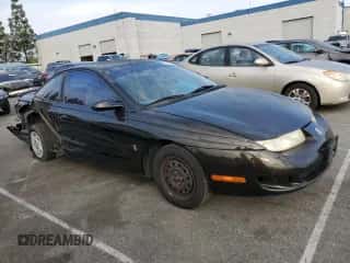 1997 Saturn SC with VIN 1G8ZF1286VZ350275, listed as a Copart auction lot 83010514 with 143,241 mi miles and Salvage title. Bid and sale history available at DreamBid. Image 4.