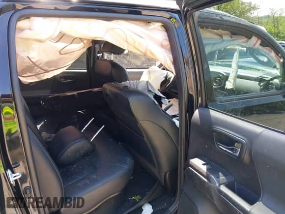 2021 Toyota Tacoma SR5 z VIN 3TYDZ5BN1MT002778, wystawiony jako IAAI lot #42591088 z przebiegiem Nie podano mil oraz . Historia ofert i sprzedaży dostępna na DreamBid. Obrazek 8.