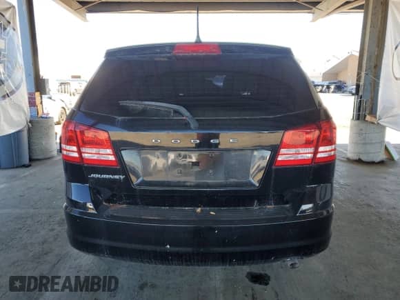 2015 Dodge Journey American Value with VIN 3C4PDCABXFT606406, listed as a Copart auction lot 82624285 with 99,373 mi miles and Clean title. Bid and sale history available at DreamBid. Image 6.