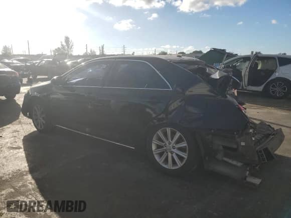 2014 Toyota Camry XLE with VIN 4T1BK1FKXEU545233, listed as a Copart auction lot 90062335 with 142,633 mi miles and Salvage title. Bid and sale history available at DreamBid. Image 2.