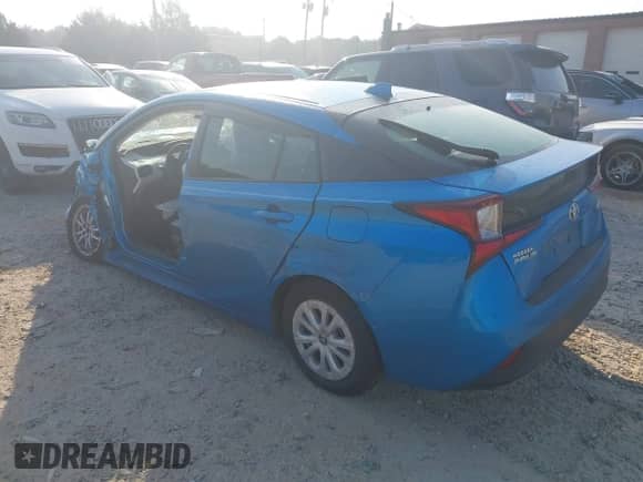 2021 Toyota Prius L Eco with VIN JTDKAMFU1M3136133, listed as a IAAI auction lot 43285926 with 49,911 mi miles and . Bid and sale history available at DreamBid. Image 3.