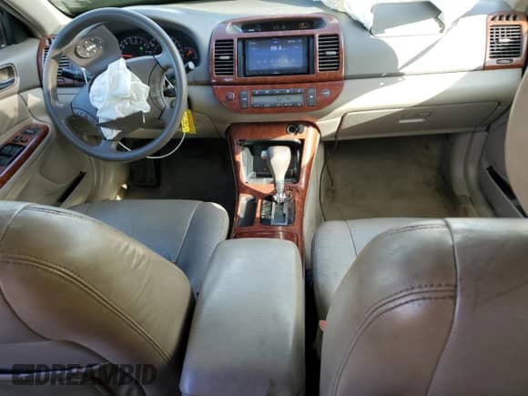 2005 Toyota Camry LE с VIN 4T1BE30K75U072189, выставлен на аукционе Copart как лот 81855195 с пробегом 210 951 миль миль и Списание • Salvage title. История ставок и продаж доступна на DreamBid. Изображение 8.