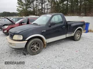 1997 Ford F-150 XL with VIN 1FTEF07L2VKB99486, listed as a Copart auction lot 86697244 with 170,058 mi miles and Salvage title. Bid and sale history available at DreamBid. Image 1.