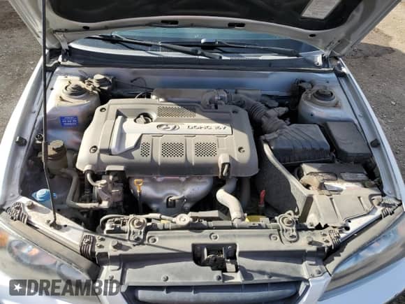 2004 Hyundai Elantra GT z VIN KMHDN56D84U130497, wystawiony jako Copart lot #49121055 z przebiegiem 96 046 mil mil oraz Szkoda całkowita • Salvage title. Historia ofert i sprzedaży dostępna na DreamBid. Obrazek 11.