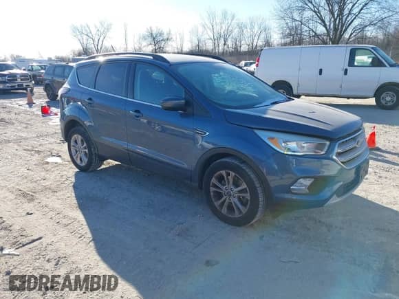 2018 Ford Escape SE with VIN 1FMCU9GD2JUA21484, listed as a IAAI auction lot 41285765 with 102,523 mi miles and . Bid and sale history available at DreamBid. Image 1.
