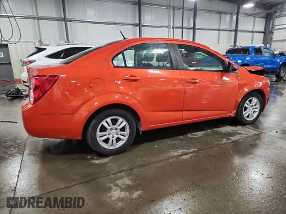 2012 Chevrolet Sonic LS с VIN 1G1JB5SH9C4136390, выставлен на аукционе Copart как лот 71676875 с пробегом 80 646 миль миль и Списание • Salvage title. История ставок и продаж доступна на DreamBid. Изображение 3.