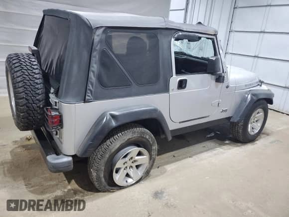 2003 Jeep Wrangler Rubicon с VIN 1J4FA69SX3P322715, выставлен на аукционе Copart как лот 63976635 с пробегом 167 842 миль миль и Списание • Salvage title. История ставок и продаж доступна на DreamBid. Изображение 3.