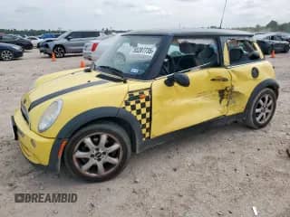 2006 MINI Hardtop with VIN WMWRC33506TK66369, listed as a Copart auction lot 65207735 with 144,546 mi miles and Salvage title. Bid and sale history available at DreamBid. Image 1.