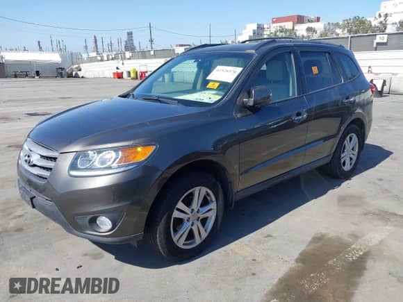 2012 Hyundai Santa Fe Limited with VIN 5XYZK4AG3CG126162, listed as a IAAI auction lot 42526570 with 878,070 mi miles and . Bid and sale history available at DreamBid. Image 2.