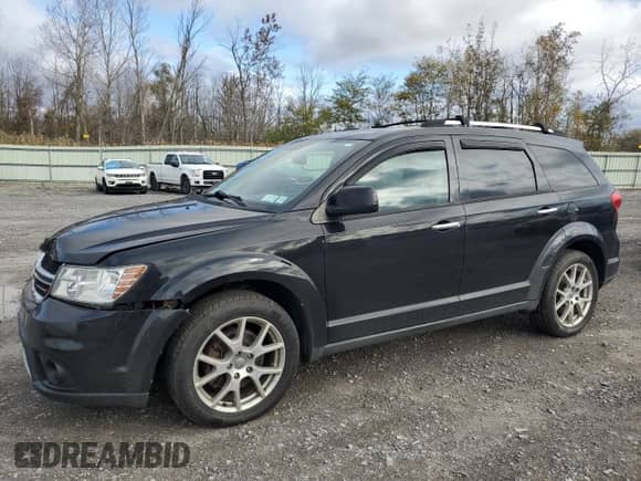 2013 Dodge Journey R/T with VIN 3C4PDDFG2DT614751, listed as a Copart auction lot 82592325 with 145,037 mi miles and Salvage title. Bid and sale history available at DreamBid. Image 1.
