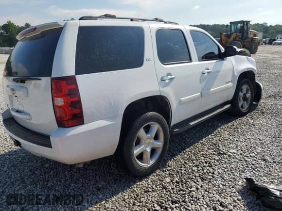 2008 Chevrolet Tahoe 1LT with VIN 1GNFC13018R191168, listed as a Copart auction lot 56855825 with 203,059 mi miles and Salvage title. Bid and sale history available at DreamBid. Image 3.
