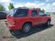 2000 Chevrolet Blazer LT with VIN 1GNDT13W8Y2392666, listed as a Copart auction lot 56652895 with 223,924 mi miles and Salvage title. Bid and sale history available at DreamBid. Image 3.