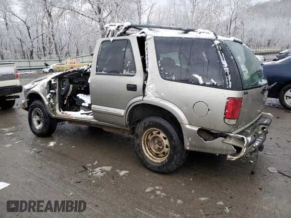 2003 Chevrolet Blazer LS с VIN 1GNCS13X63K129026, выставлен на аукционе Copart как лот 84567954 с пробегом Не указан миль и Списание • Salvage title. История ставок и продаж доступна на DreamBid. Изображение 2.