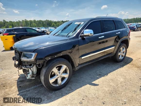 2012 Jeep Grand Cherokee Overland with VIN 1C4RJFCT9CC346497, listed as a Copart auction lot 63004635 with 142,623 mi miles and Salvage title. Bid and sale history available at DreamBid. Image 1.