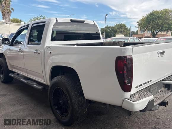 2011 Chevrolet Colorado 1LT z VIN 1GCHTCFE3B8106686, wystawiony jako Copart lot #70392165 z przebiegiem 157 398 mil mil oraz Czysty tytuł • Clean title. Historia ofert i sprzedaży dostępna na DreamBid. Obrazek 3.