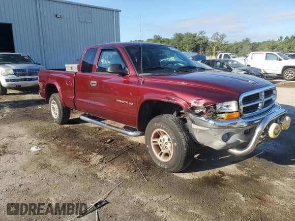 2000 Dodge Dakota Sport with VIN 1B7GG22N4YS610725, listed as a Copart auction lot 83965225 with 128,401 mi miles and Salvage title. Bid and sale history available at DreamBid. Image 4.