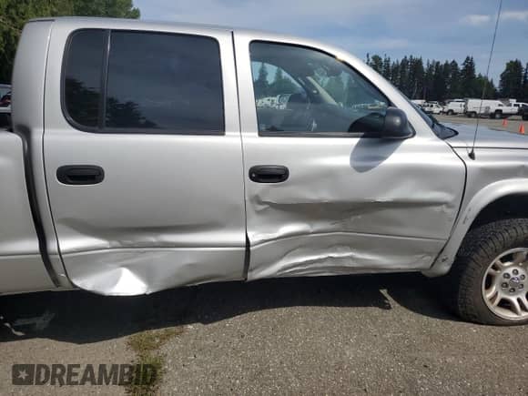 2003 Dodge Dakota Sport с VIN 1D7HG38N23S309001, выставлен на аукционе Copart как лот 56595945 с пробегом 130 864 миль миль и Списание • Salvage title. История ставок и продаж доступна на DreamBid. Изображение 10.