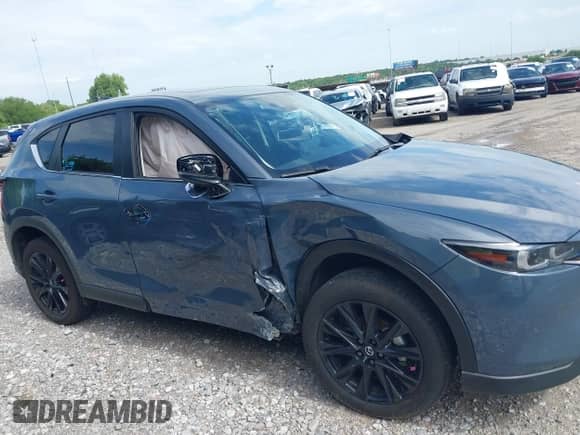 2025 Mazda CX-5 S Carbon Edition z VIN JM3KFBCM8S0646821, wystawiony jako IAAI lot #42610837 z przebiegiem Nie podano mil oraz . Historia ofert i sprzedaży dostępna na DreamBid. Obrazek 13.