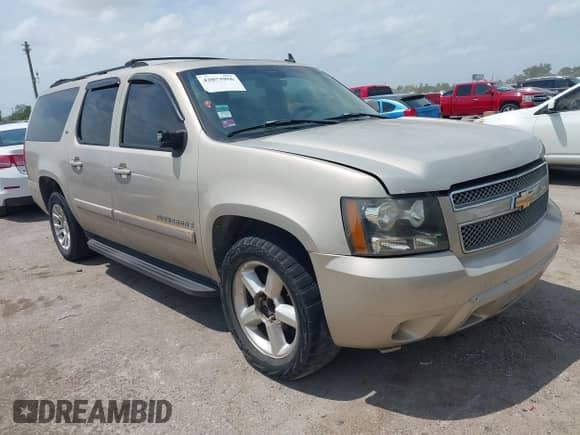 2007 Chevrolet Suburban LTZ z VIN 3GNFC16077G143345, wystawiony jako IAAI lot #42073956 z przebiegiem Nie podano mil oraz . Historia ofert i sprzedaży dostępna na DreamBid. Obrazek 1.