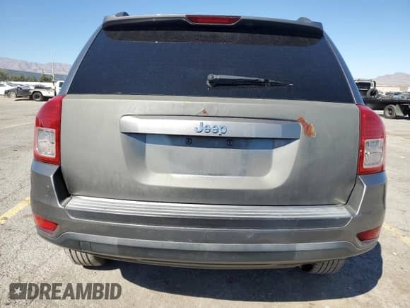 2012 Jeep Compass Sport z VIN 1C4NJCBA0CD618121, wystawiony jako Copart lot #84818275 z przebiegiem 170 126 mil mil oraz Szkoda całkowita • Salvage title. Historia ofert i sprzedaży dostępna na DreamBid. Obrazek 6.